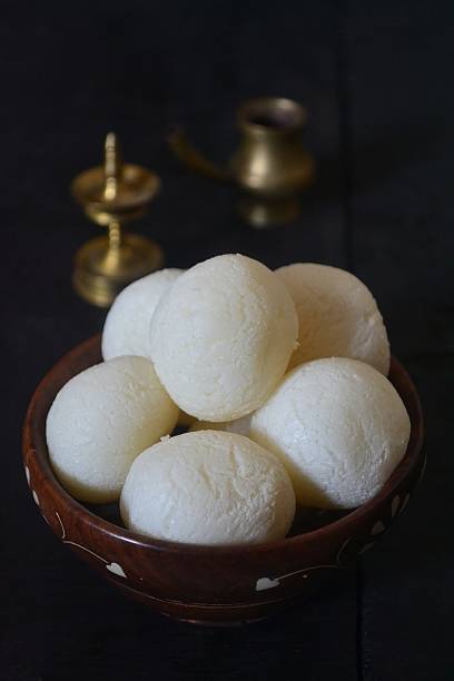 rasgulla/dessert in a wooden bowl - rasgulla stock pictures, royalty-free photos & images