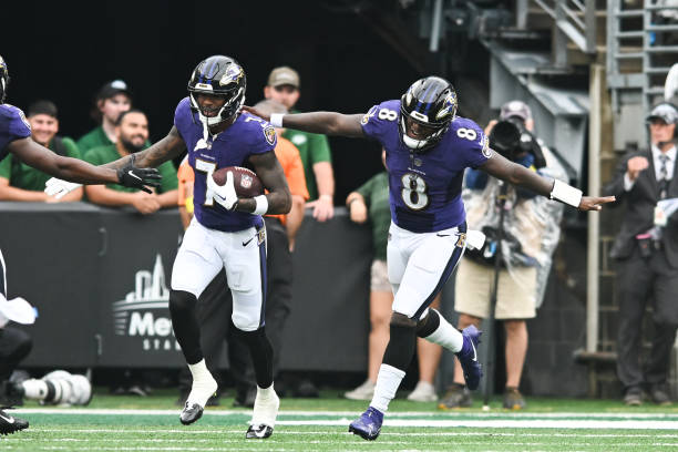 Rashod Bateman and Lamar Jackson of the Baltimore Ravens celebrate after a touchdown during the game against the New York Jets at MetLife Stadium on...