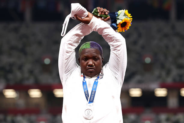Raven Saunders of Team United States makes an 'X' gesture during the medal ceremony for the Women's Shot Put on day nine of the Tokyo 2020 Olympic...