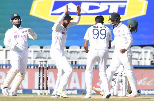 Ravichandran Ashwin of India celebrates with teammates after dismissing Keegan Petersen of South Africa during day 3 of the 2nd Betway WTC Test match...