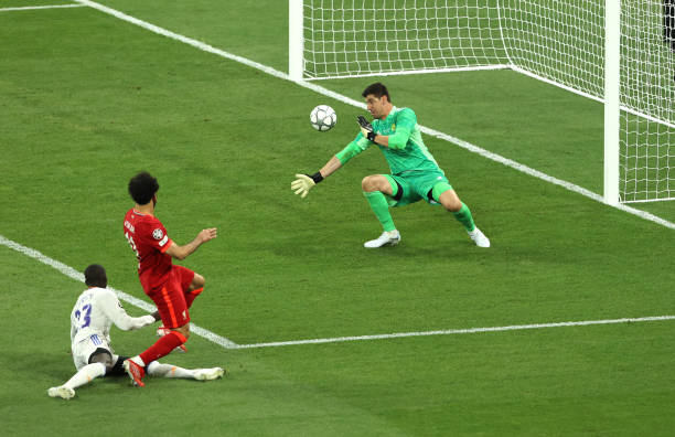 Real Madrid goalkeeper Thibaut Courtois saves a shot by Mohamed Salah of Liverpool during the UEFA Champions League final match between Liverpool FC...
