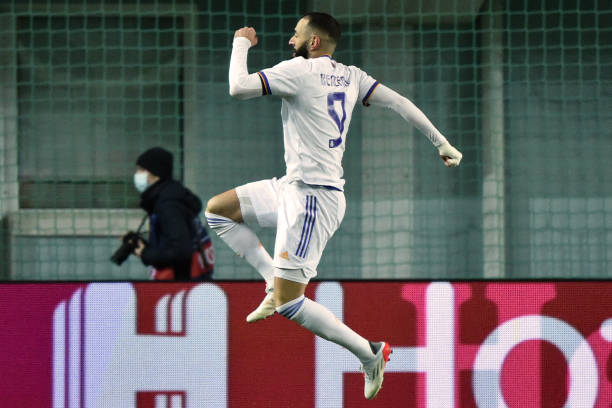 Real Madrid's French forward Karim Benzema celebrates after scoring their third goal during the UEFA Champions League football match between Sheriff...