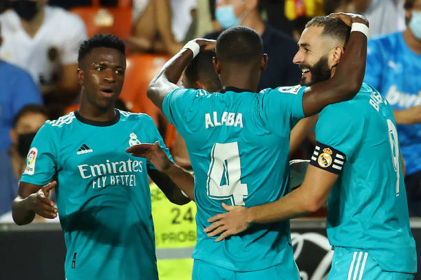 Real Madrid's French forward Karim Benzema celebrates scoring his team's second goal with Real Madrid's Austrian defender David Alaba and Real...
