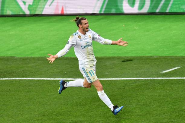 Real Madrid's Welsh forward Gareth Bale celebrates after scoring the the 3-1 during the UEFA Champions League final football match between Liverpool...
