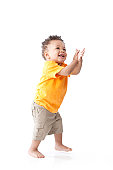 Real People: Black Laughing Toddler Boy Orange Standing Clapping