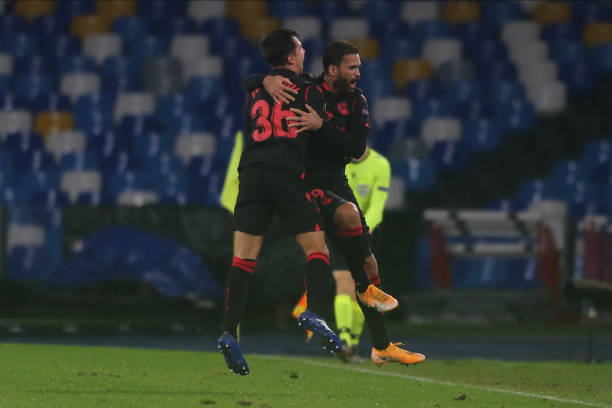Real sociedad's Brazilian striker Willian José celebrates after scoring a goal with Real sociedad's Spanish midfielder Martín Zubimendi during the...