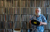 Record collector in front of his collection