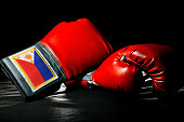 Red Filipino Boxing Gloves on a Black Background