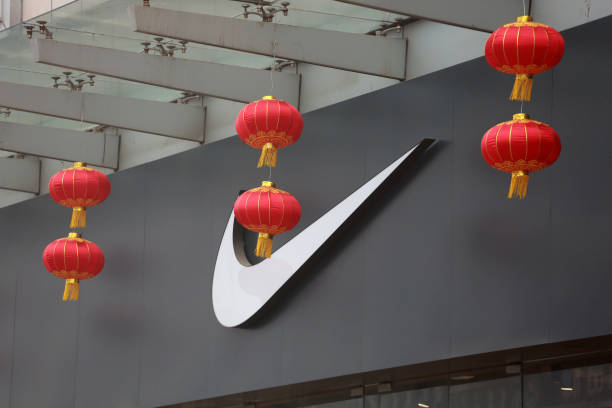 red lanterns are seen decorated in front of a nike store ahead of the picture