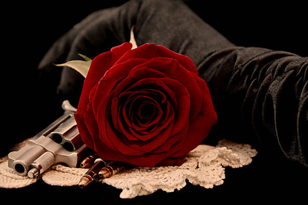 red-rose-with-handgun-picture-id474317826