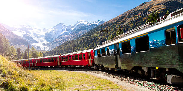 red train and bernina pass view - mountain railway stock pictures, royalty-free photos & images