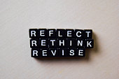 Reflect - Rethink - Revise on wooden blocks. Business and inspiration concept