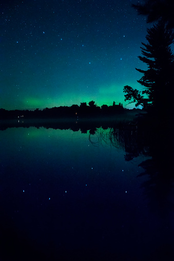Reflection of Big Dipper and Aurora Borealis in lake 484739754