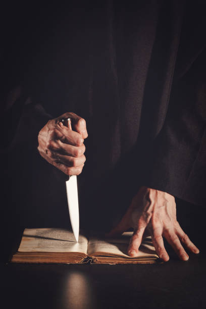 Religious man holding knife.
