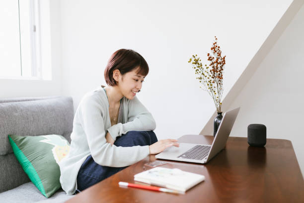 remote working - young asian woman working from home office - productive person stock pictures, royalty-free photos & images