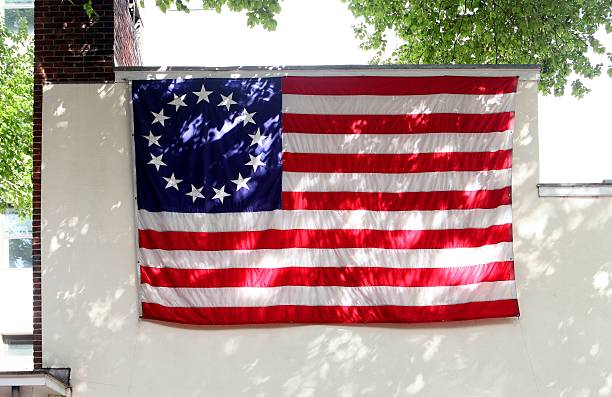 Replica 'Betsy Ross Flag' is posted on the side of the Betsy Ross House in Philadelphia, Pennsylvania on August 27, 2016.