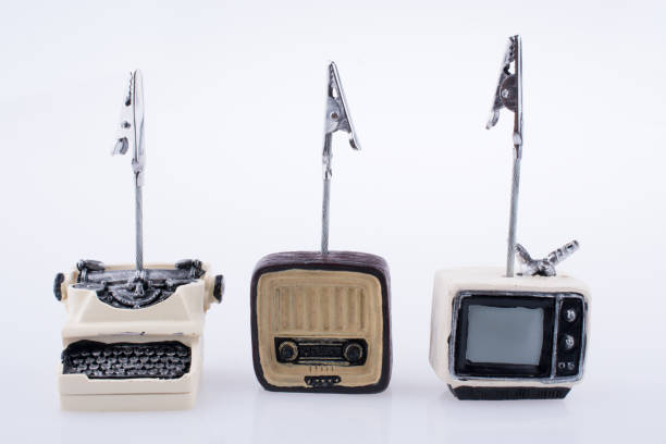 Retro syled tiny television,Radio and typewriter model on white