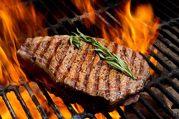 ribeye steak on grill with fire picture id155100060?k=20&m=155100060&s=612x612&w=0&h=aR6yBHb8eqPRB8vqAmYUP LgmT0 2orRoRQ1ueyH EI=