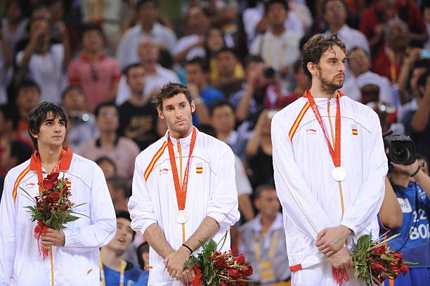 Ricky Rubio, Rudy Fernandez, and Pau Gasol of Spain celebrates winning the men's silver medal basketball game at the 2008 Beijing Olympic Games at...