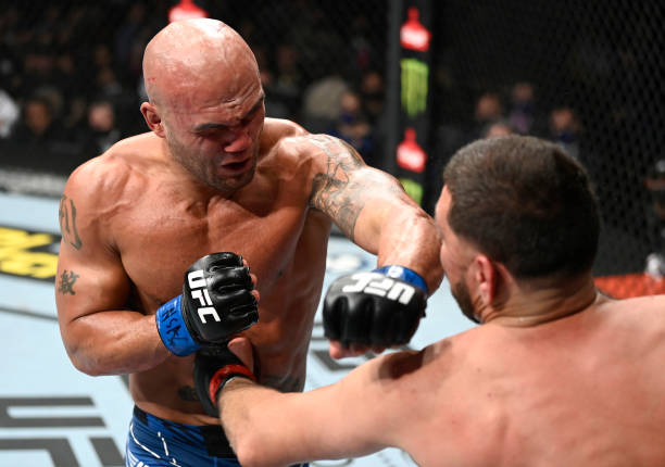 Robbie Lawler punches Nick Diaz in their middleweight fight during the UFC 266 event on September 25, 2021 in Las Vegas, Nevada.
