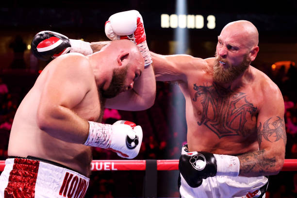 Robert Helenius punches Adam Kownacki during their heavyweight bout at T-Mobile Arena on October 09, 2021 in Las Vegas, Nevada.