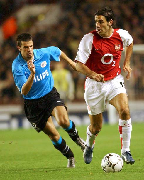 Robert Pires of Arsenal takes on the PSV Eindhoven defence during the UEFA Champions League Group A match between Arsenal and PSV Eindhoven at...