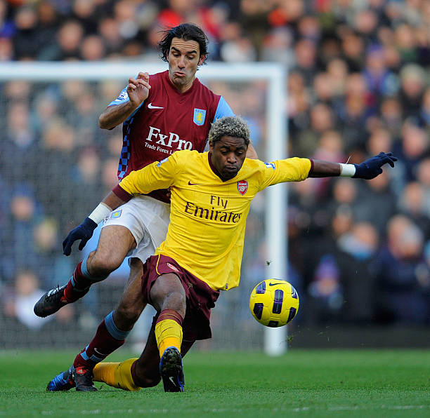 Robert Pires of Aston Villa tackles Alex Song of Arsenal during the Barclays Premier League match between Aston Villa and Arsenal at Villa Park on...