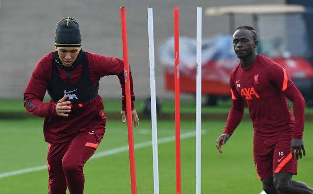 Roberto Firmino of Liverpool with Sadio Mane of Liverpool during a training session at AXA Training Centre on December 24, 2021 in Kirkby, England.
