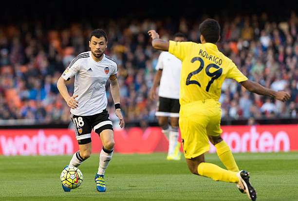 Rodrigo of Villarreal CF and Javi Fuego of Valencia during the Spanish League Match match at Estadio Mestalla Valencia on 1May of 2016