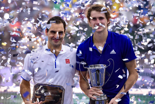 Roger Federer of Switzerland and Alexander Zverev of Germany pose with trophies after an exhibition game between Alexander Zverev and Roger Federer...