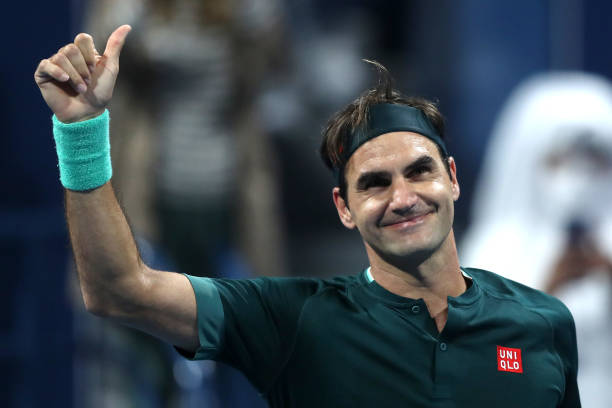 Roger Federer of Switzerland celebrates winning his match against Dan Evans of Great Britain on Day 3 of the Qatar ExxonMobil Open at Khalifa...