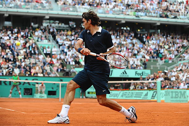 roger-federer-of-switzerland-hits-a-backhand-to-rafael-nadal-of-spain-picture-id524095980