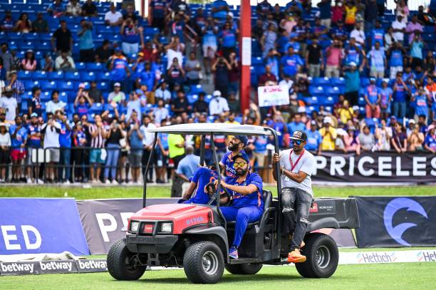 Rohit Sharma, of India, drives a quad-motor around the field as he celebrates after winning the fifth and final T20I match between West Indies and...
