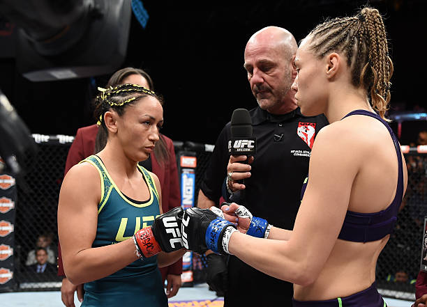 Rose Namajunas and Carla Esparza face-off in their strawweight championship fight during The Ultimate Fighter Finale event inside the Pearl concert...