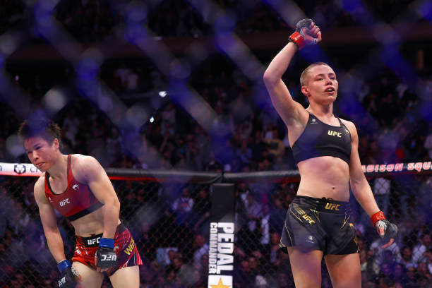 Rose Namajunas reacts against Zhang Weili in their strawweight title bout during the UFC 268 event at Madison Square Garden on November 06, 2021 in...