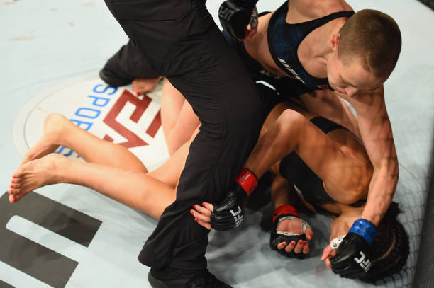 Rose Namajunas takes down Joanna Jedrzejczyk of Poland in their UFC women's strawweight championship bout during the UFC 217 event at Madison Square...