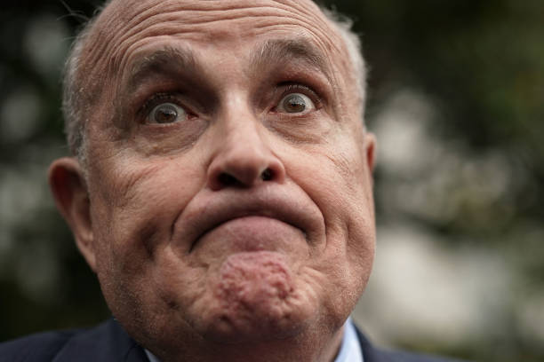 Rudy Giuliani, former New York City mayor and current lawyer for U.S. President Donald Trump, speaks to members of the media during a White House...