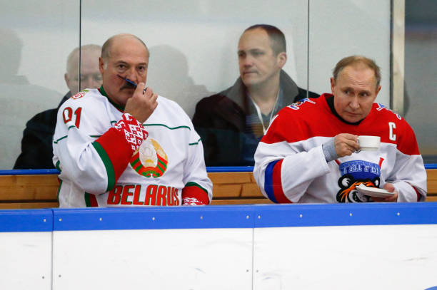 Russian President Vladimir Putin and Belarusian President Alexander Lukashenko take part in an ice hockey match at Rosa Khutor outside the Black Sea...