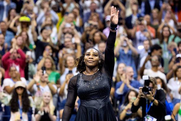 S Serena Williams waves to the audience after losing against Australia's Ajla Tomljanovic during their 2022 US Open Tennis tournament women's singles...
