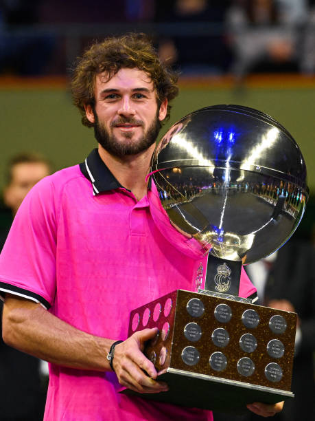 s-tommy-paul-poses-with-the-trophy-after-winning-his-singles-final-picture-id1236542217
