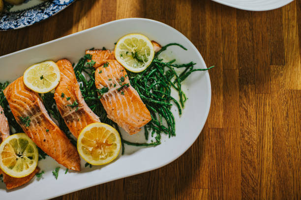 salmon on a serving plate on a table picture
