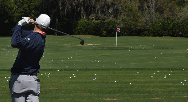 Sam Burns of the United States practices on the driving range before the third round of the Arnold Palmer Invitational golf tournament at the Bay...