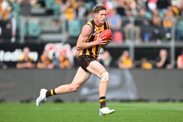 Sam Frost of the Hawks runs the ball during the round six AFL match between the Hawthorn Hawks and the Sydney Swans at UTAS Stadium on April 25, 2022...