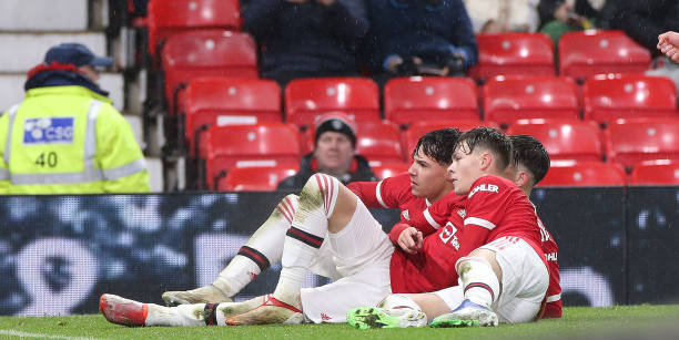 Sam Mather of Manchester United U18s celebrates with team mates Alejandro Garnacho and Charlie McNeill after scoring the first goal during the FA...