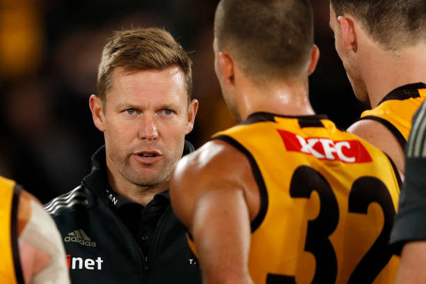 Sam Mitchell, Senior Coach of the Hawks addresses his players during the 2022 AFL Round 08 match between the Essendon Bombers and the Hawthorn Hawks...