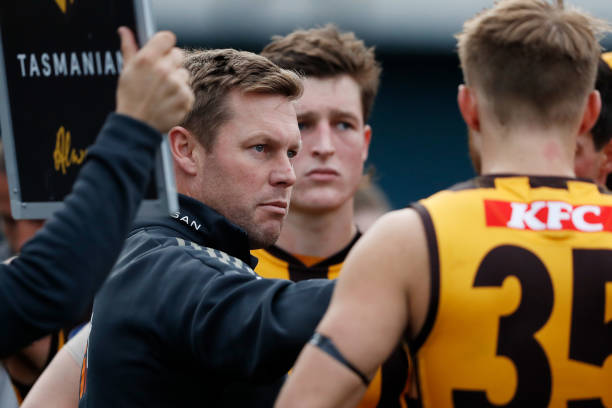 Sam Mitchell, Senior Coach of the Hawks addresses his players during the 2022 AFL Round 19 match between the North Melbourne Kangaroos and the...