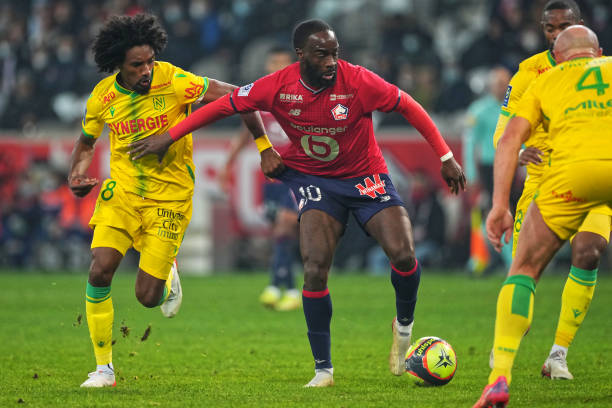 Samuel Moutoussamy of FC Nantes competes for the ball with Jonathan Ikone of Lille OSC during the Ligue 1 Uber Eats match between Lille OSC and FC...