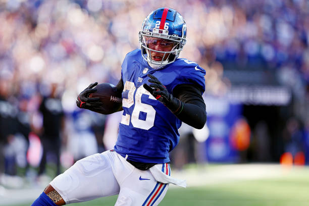 Saquon Barkley of the New York Giants runs the ball during the fourth quarter against the Buffalo Bills at MetLife Stadium on October 16, 2022 in...