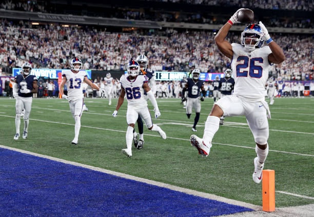 Saquon Barkley of the New York Giants scores a 36 yard touchdown against the Dallas Cowboys during the third quarter in the game at MetLife Stadium...