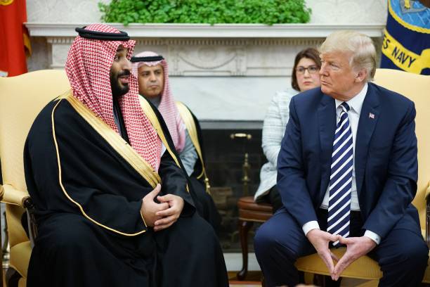 Saudi Arabia's Crown Prince Mohammed bin Salman speaks during a meeting with US President Donald Trump in the Oval Office of the White House on March...